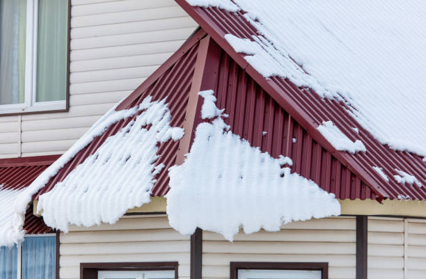 istock A house with a red roof covered in snow 2187253904