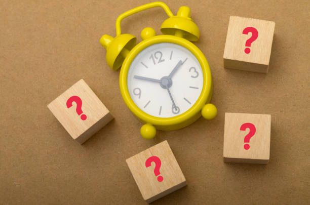 istock Question Marks and Clock: Symbolizing Time Management and Uncertainty in Decision-Making 2187254959