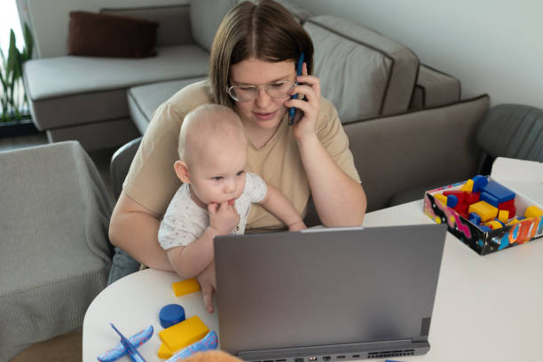 istock A busy parent struggles to balance work and caring for their baby while working from home 2187255746