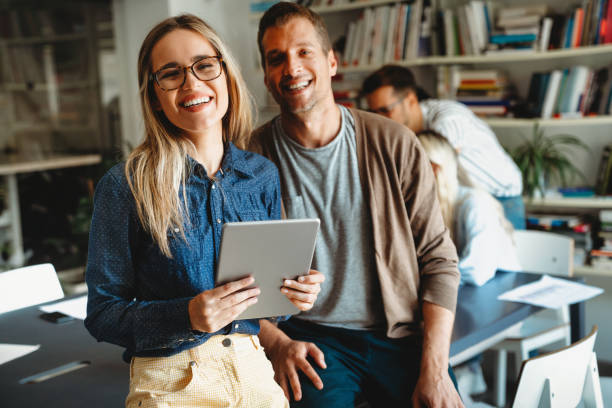 istock Group of young multi-ethnic startup business team collaborating on project in modern office 2187256575