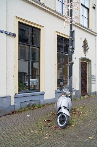 istock Retro scooter stands in the city against a lamppost 2187257300