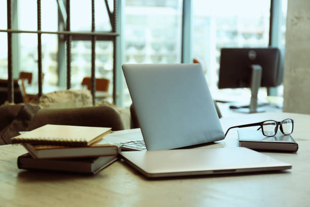 istock Office table with coffee, laptop and office papers, notebooks 2187257741