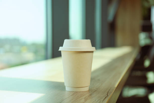 istock A cup of coffee on the table near the window 2187257953