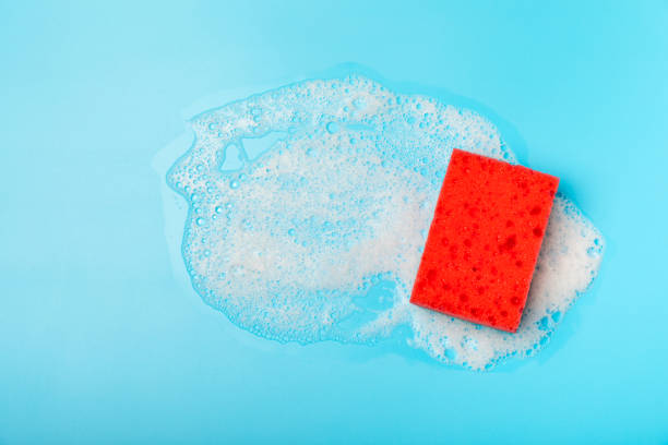 istock Colorful dish sponges on textured background. Kitchen sponge. Cleaning concept, cleaning service. Dishwashing liquid with clean and dirty dishes plate. Place for text, copy space. Wash the dishes. 2187260939