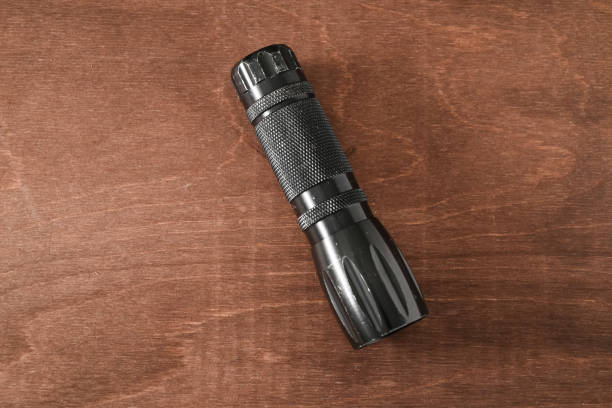 Unrecognizable male holding a flashlight