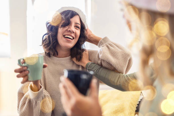 istock Friends Enjoying Coffee During Christmas 2187261859