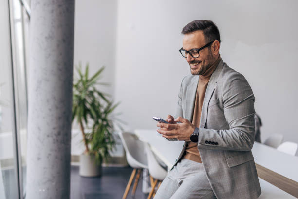istock A businessman with a cell phone 2187263740