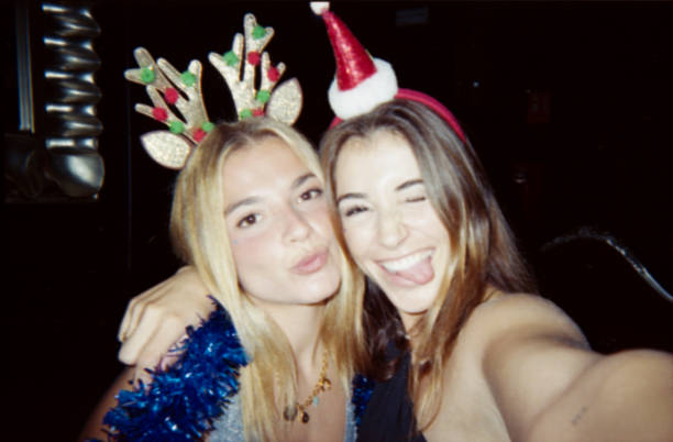 istock Two young women smiling, celebrating Christmas with festive accessories 2187265621