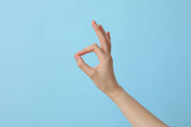 istock Female hand shows OK gesture. OK hand sign 2187265822
