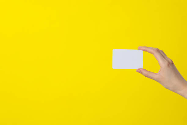 istock White blank paper in female hands, place for text 2187266048