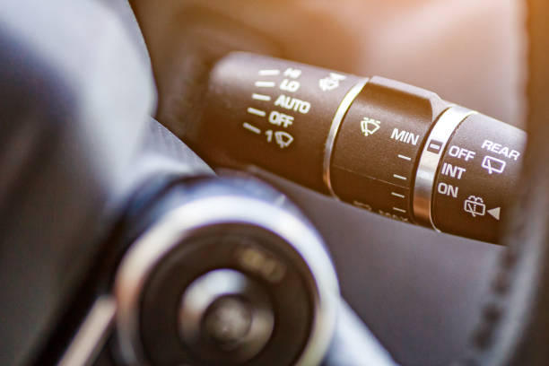 istock Inside the car.Car rain windscreen wiper control stickVehicle interior.Dashboard, inner workings of a car. 2187267317