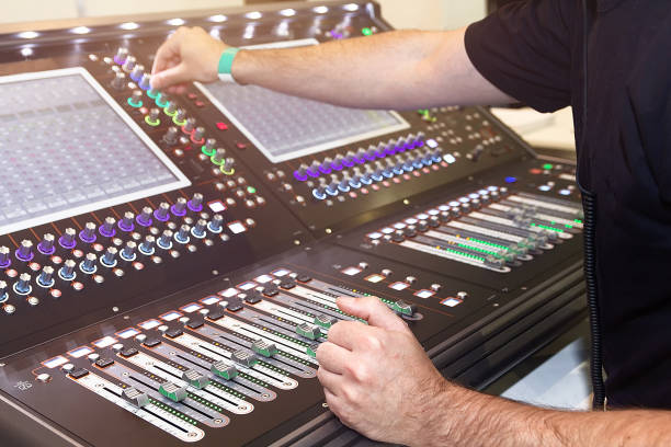 istock Sound engineer hands adjusting control sound mixer in recording, broadcasting studio 2187269377