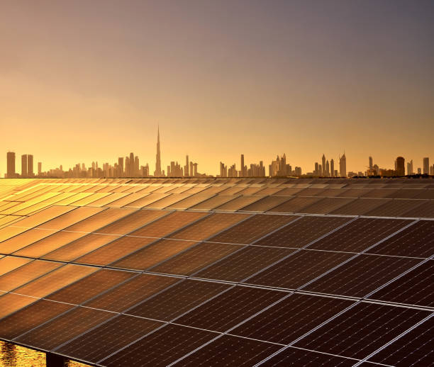 Dubai Skyline and Solar Panels at Sunset, United Arab Emirates stock photo