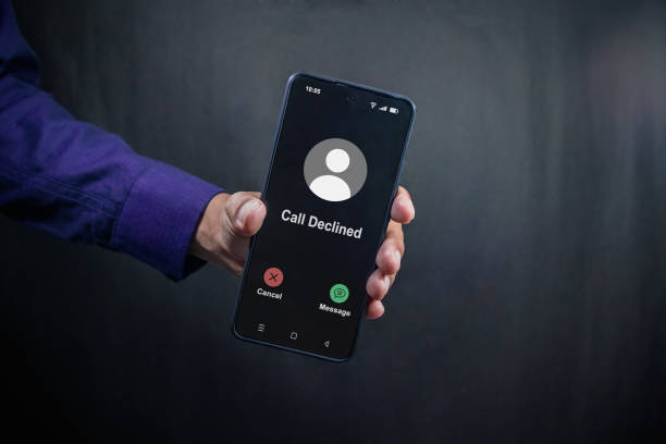 istock Man holding a smartphone with Call Declined screen. Rejected phone call concept. 2187272340