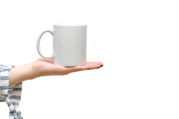 istock Woman's female hand holding white cup mug of coffee,tea. Blank empty mockup,template for design, branding, logo,business.Morning concept on white background with copy space 2187274633