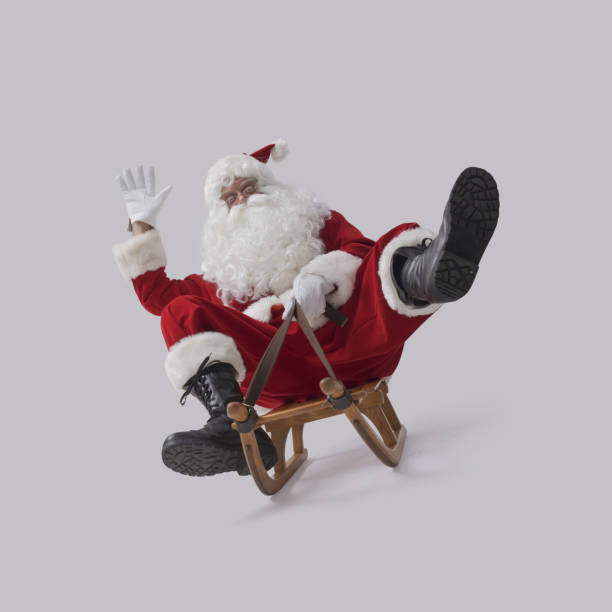 istock Funny Santa Claus riding a sleigh 2187274982