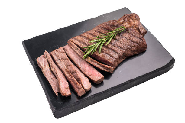 istock Grilled medium beef Rump steak on marble board isolated on white background 2187275312