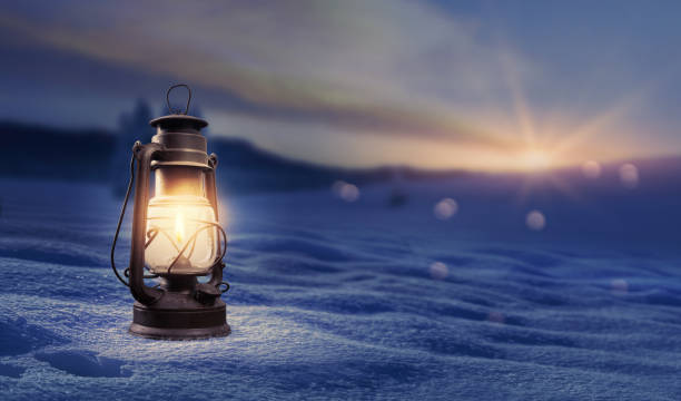 istock Old traditional lantern on the snow 2187275659