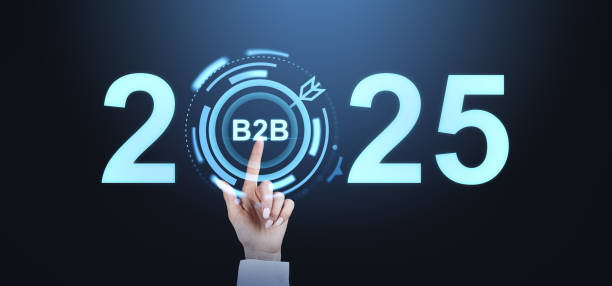 istock Hand pointing to B2B in a futuristic interface between the numbers 2025 glowing on dark background, representing business strategy and planning. 2187277750