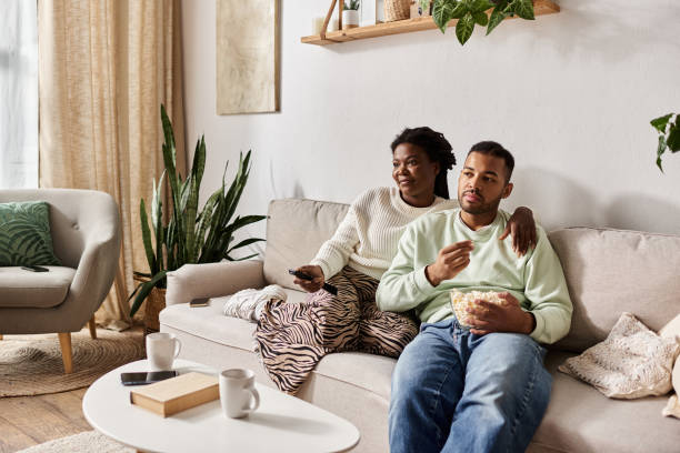 istock Cozy moments shared between a couple in warm sweaters on a winter evening 2187278597