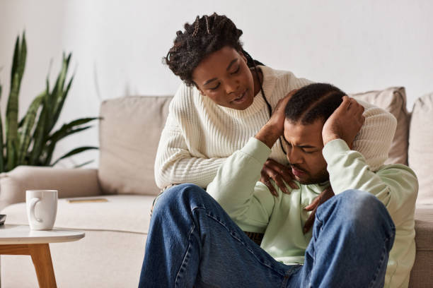 istock Cozy moments shared between a couple in winter sweaters at home 2187278784