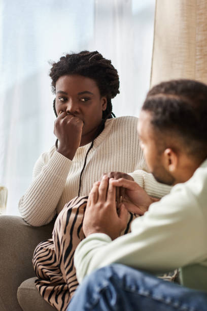 istock Cozy moments shared between an affectionate couple in their warm winter sweaters at home 2187278833