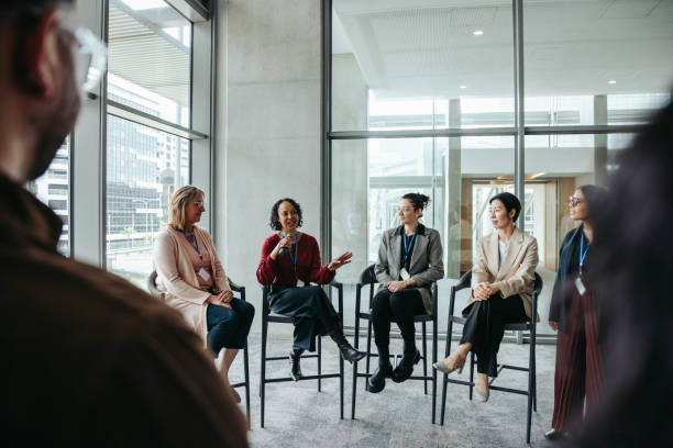 istock Group discussion with diverse professionals sharing expertise in a modern office setting 2187278916