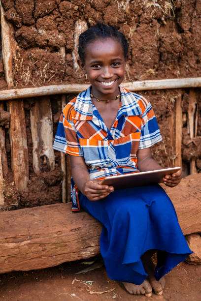 istock African girl using digital tablet, East Africa 2187281862