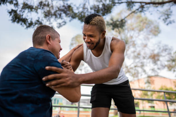 istock Friends greeting each other at public park 2187282689