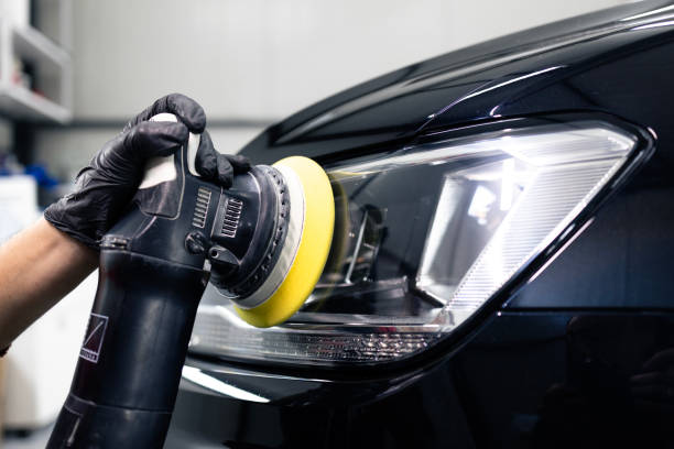 istock Car detailing and polishing headlights. 2187283146