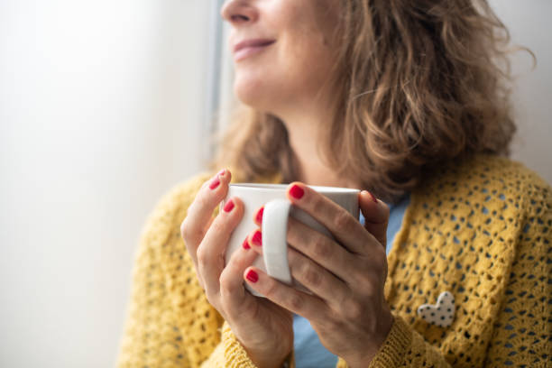istock Serene woman enjoying her coffee at home 2187283630