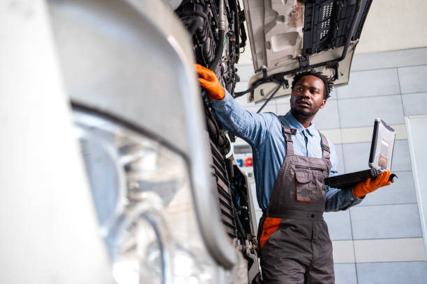 istock Experienced serviceman checking truck vehicle. 2187283644