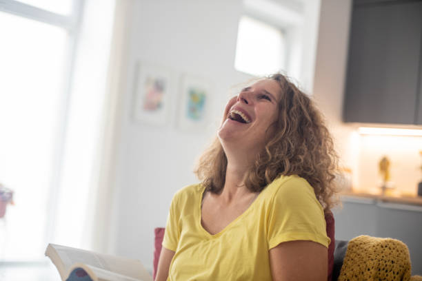 istock Enjoying reading a book at home 2187283986