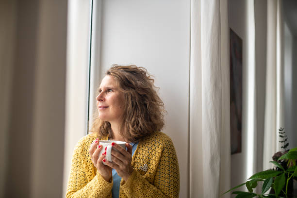 istock Serene woman enjoying at home 2187284235