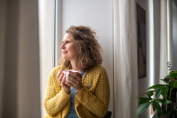 istock Serene woman enjoying at home 2187284275