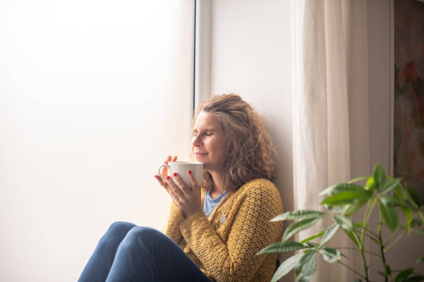 istock Serene woman enjoying at home 2187284306