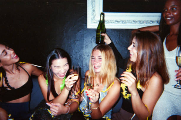 A group of friends joyfully celebrating with champagne, captured in a vintage retro style with a nostalgic and dusty aesthetic.