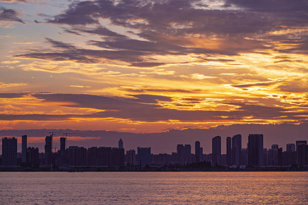 istock Sunset over the modern urban skyline with dramatic sky and clouds 2187286656