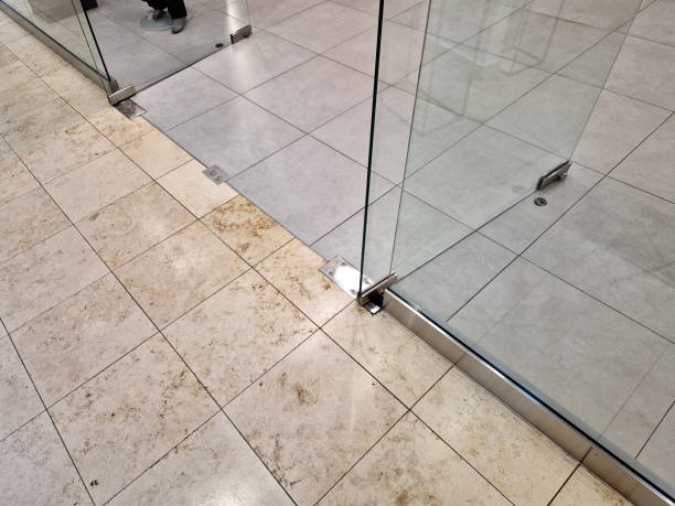 istock frameless glass door. glazed partitions have special hinges and handles. everything is drilled into the glass and attached with stainless steel screws. polished bar handle 2187287637