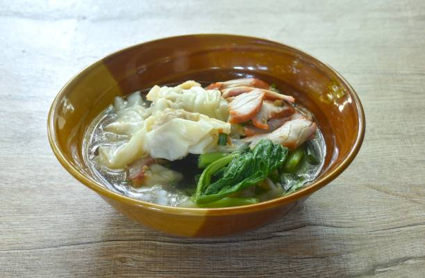 istock Chinese dumpling topping slice red barbecue pork with clear soup 2187289308