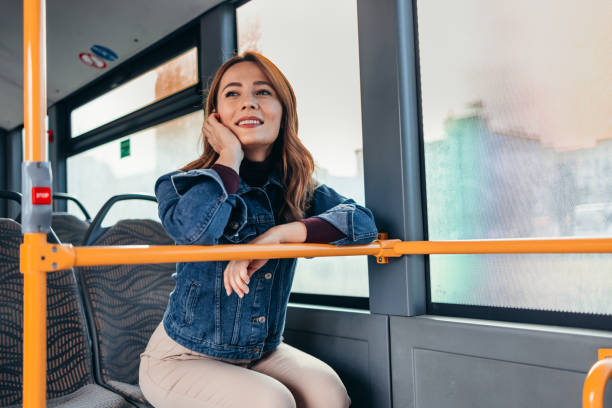 istock Young woman commuting by bus 2187291399