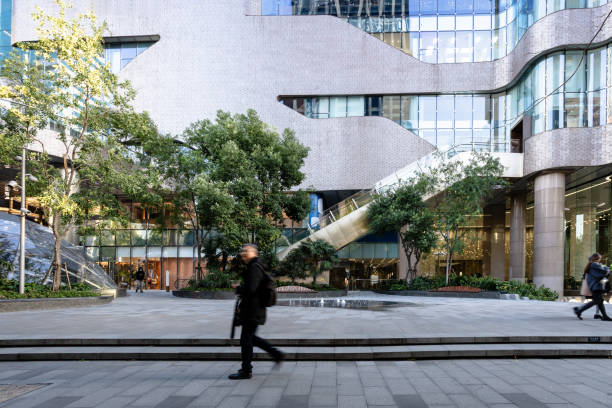 istock Male commuters walk past the mall square 2187296272