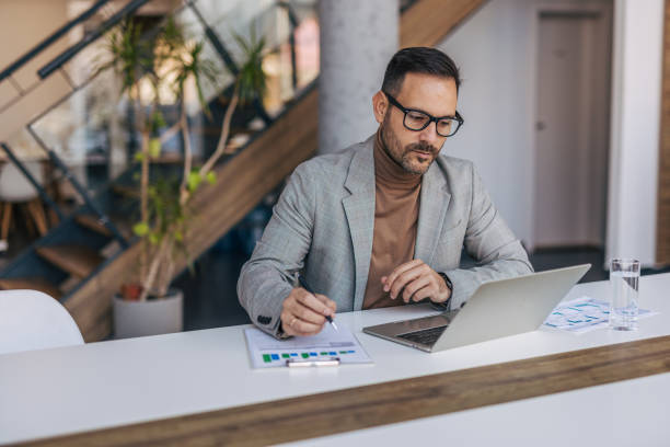 istock A businessman is looking for a new business strategy. 2187296797