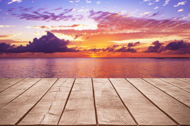 istock Empty wooden table top with tropical ocean sunset background 2187297581