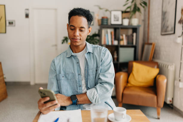 istock Thoughtful Young Man in Cozy Cafe Atmosphere 2187301635
