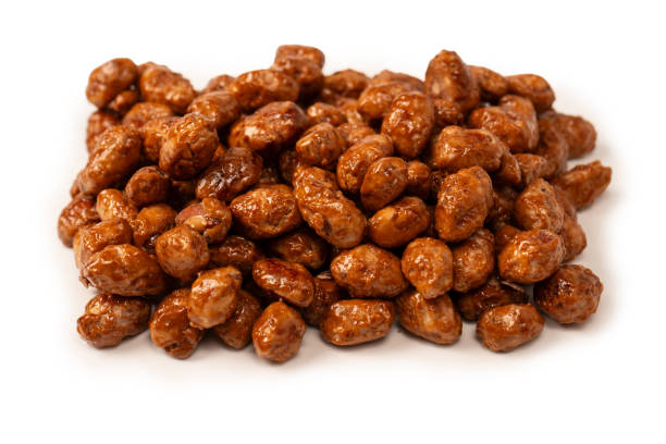 istock Tasty sweet roasted peanuts isolated on a white background. 2187301681