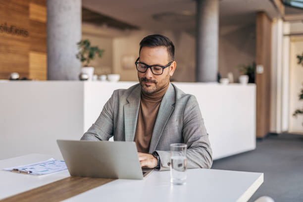 istock A businessman is in a meeting room, preparing a presentation 2187301743