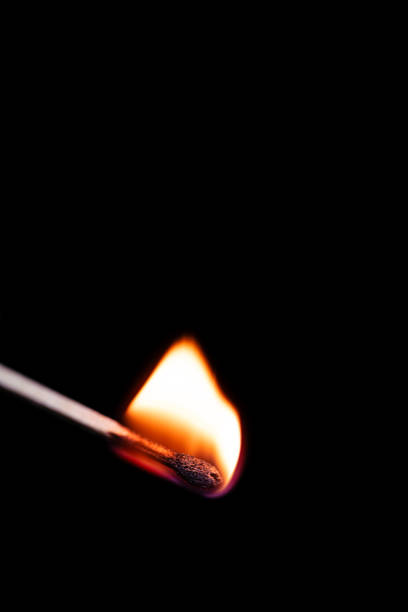 istock Burning match on black background macrophotography 2187302812