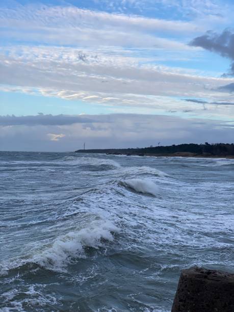 istock Waves and Wind Turbine Horizon 2187303290