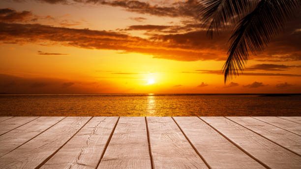 istock Empty wooden table top with tropical ocean sunset background 2187304604
